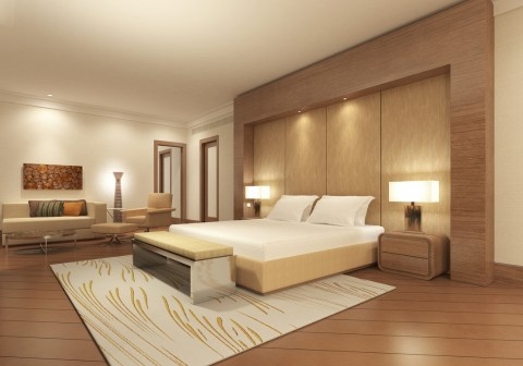 Modern master bedroom interior design in Chandigarh with sliding wardrobe, false ceiling, ambient lighting, wooden flooring, and luxury wall panel design for a 3BHK apartment interior project.